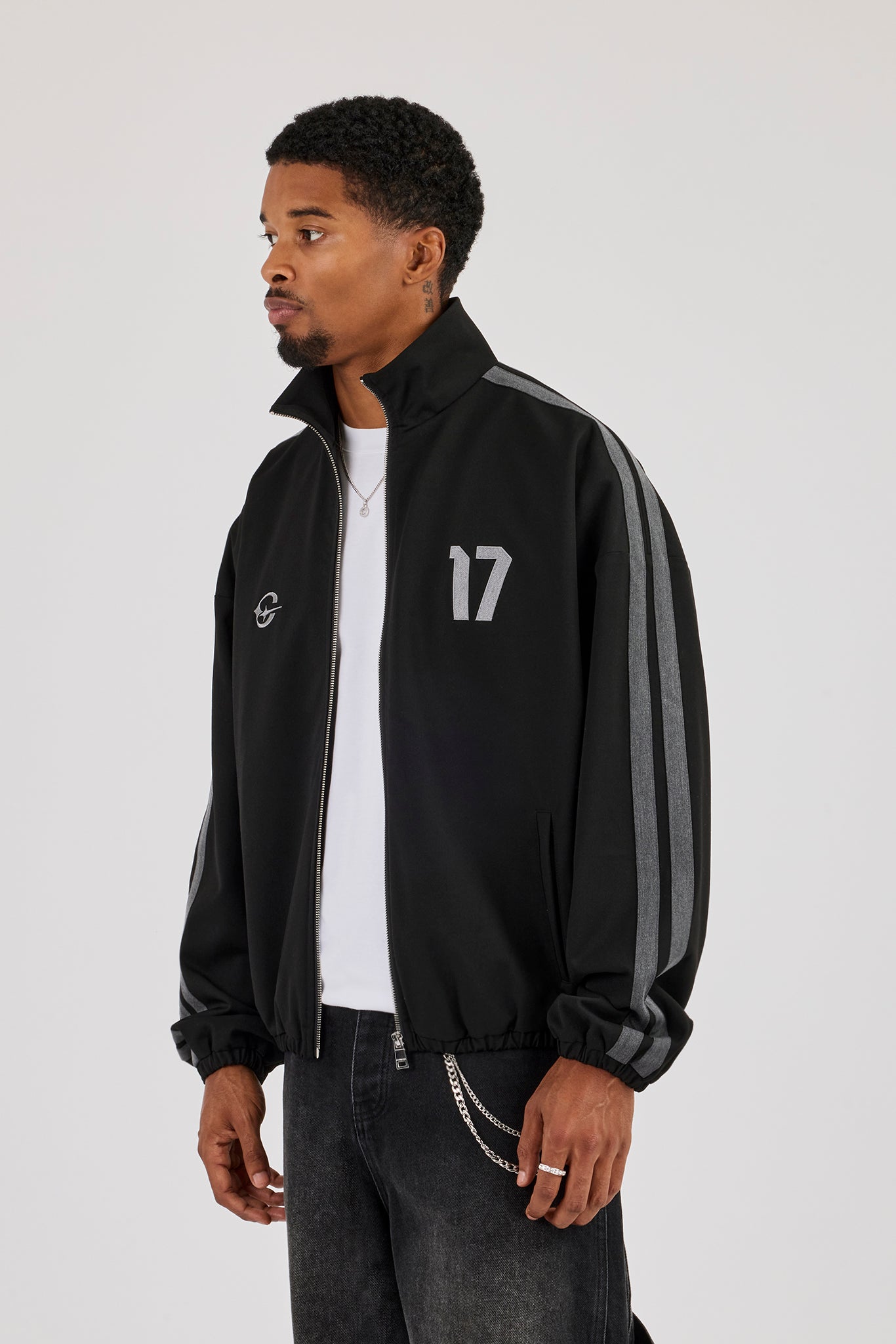 Web-Trainingsjacke mit Seitenstreifen – Schwarz